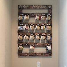 a coffee cup display in the corner of a bathroom