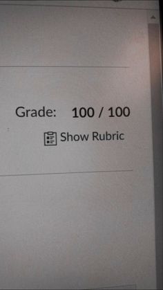 a sign that says grade 100 / 100 show rubric