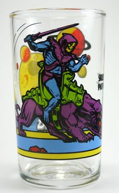 a shot glass with an image of a man riding a horse and holding a baseball bat