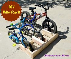 two children's bikes are attached to wooden crates on the sidewalk with text overlay that reads diy bike rack