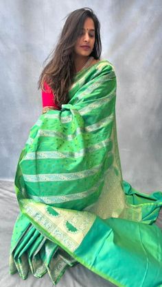 Inspired by ancient Mughal architecture, this beautiful dual tone pure mashru silk saree has intricate gold zari weaving in mehrab pattern and has small buttis in blue contrast colour all over the body. Blouse: parrot green pure mashru silk material [Unstitched] Festive Green Paithani Silk Pre-draped Saree, Festive Green Pre-draped Saree With Zari Weaving, Green Paithani Silk Pre-draped Saree With Self Design, Green Pre-draped Saree With Zari Weaving For Diwali, Green Pre-draped Saree With Self Design For Diwali, Green Dola Silk Saree For Puja, Pista Green Paithani Silk Saree, Green Tussar Silk Traditional Wear With Dupatta, Green Tussar Silk Saree For Navratri