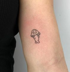 a person with a small tattoo on their arm