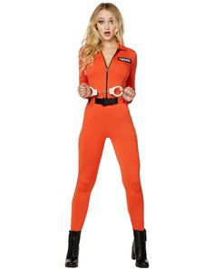 a woman in an orange jumpsuit with handcuffs on her belt and black boots is posing for