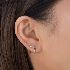 Minimal Silver Vermeil Huggie earrings with sparkly Emerald gemstone details. Perfect to wear alone or paired with other dainty earrings. .925 Sterling Silver Emerald CZ Crystal Hypoallergenic, lead and nickel free Hoop Width: 1.5mm, Crystal 3mm Inside Diameter:8.5mm Click close mechanism #E552 gemstone-bead-huggies-pink-sapphire-sterling-silvergemstone-bead-huggies-emerald-sterling-silvergemstone-bead-huggies-blue-sapphire-sterling-silvergemstone-bead-huggies-blue-zircon-sterling-silver Double Ear Piercings, Small Silver Hoop Earrings, Pretty Ear Piercings, Huggie Earrings Silver, Pave Beads, Minimal Earrings, Dainty Studs, Pink Gemstones, Huggie Earrings