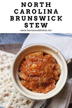 a white bowl filled with stew next to crackers