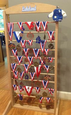 a wooden rack with medals on it