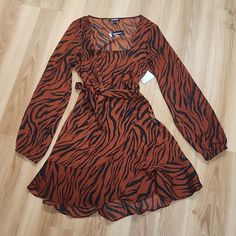 Nwt Express Animal Print Dress Sz. Small/P. A Must Have Casual Dress. Fabric Is Light & Cool. Great For Spring/Summer & Fall Brown Printed Dress For Fall, Trendy Long Sleeve Brown Dress, Trendy Brown V-neck Dress, Brown Printed Mini Dress For Summer, Casual Brown Mini Dress For Party, Chic Brown Printed Dress, Trendy Brown Beach Dress, Summer Tiger Print Dress For Date Night, Spring Printed Brown Mini Dress