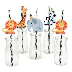 there are many zebras and giraffes in the glass bottles with straws