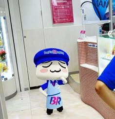 a person standing in front of a counter with an item on it's head