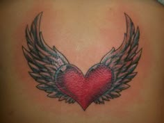 a heart with wings tattoo on the back