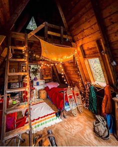 an attic bedroom is decorated with string lights and bed linens in the loft area