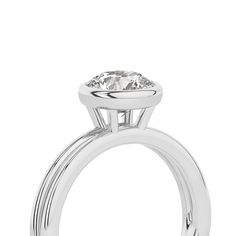 Crafted with exquisite detail, this Coupled Round Bezel Ring features a brilliant round lab-grown diamond nestled within a unique dual-band design. One band gleams in lustrous white gold, while the other elegantly contrasts in either romantic rose gold or striking yellow gold. All white gold option is also available. This solitaire diamond ring perfectly blends contemporary sophistication and classic charm, making it an ideal choice for engagements, anniversaries, or simply as a symbol of enduri 14k White Gold Diamond Ring With Tension Setting, Elegant Promise Diamond Ring With Bezel Setting, Diamond Solitaire Halo Ring, Solitaire White Gold Halo Ring With Round Cut, White Gold Platinum Diamond Ring With Round Band, Timeless Platinum Ring With Classic Cut, Classic Round Halo Ring With Lab Grown Diamond, Classic Halo Ring With Lab Grown Diamond, Platinum Solitaire Diamond Ring With Round Stone