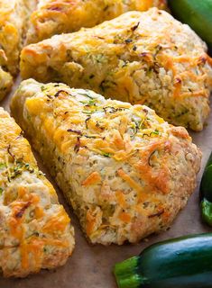 several pieces of bread with cheese and vegetables around it