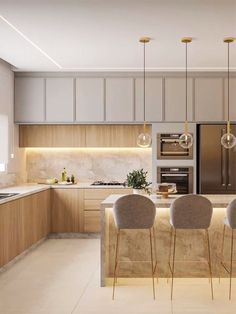 the kitchen is clean and ready to be used for dinner or dinner party, as well as bar stools