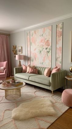 the living room is decorated in pastel colors and has pink accents on the walls