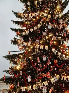 a christmas tree is decorated with ornaments and lights