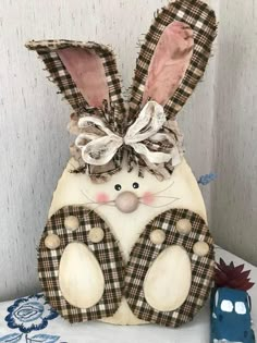 a wooden bunny sitting on top of a table