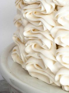 a large pile of white icing sitting on top of a table