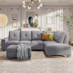 a living room with a gray sectional couch