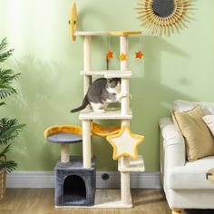 a cat sitting on top of a scratching tower