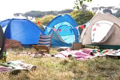 there are many tents set up in the grass