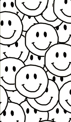 a black and white drawing of smiley faces