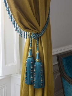 a curtain with tassels hanging from it