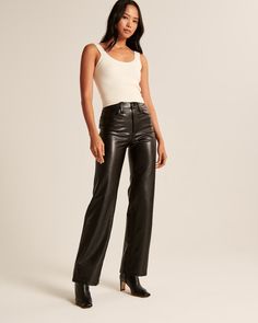 Ultra high rise pants in our luxe vegan leather fabric, featured in our classic 90s Relaxed fit, with functional pockets and a zipper closure. 90s Pants, Female Features, Iconic 90s, Relaxed Pants, Relax Pants, Black Leather Pants, Leather Pant, High Rise Pants, Faux Leather Pants