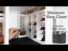 someone is opening the shoe closet with their camera in front of them and another person holding a pen