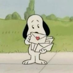 a cartoon dog holding an envelope in its paws while standing on the side of a road