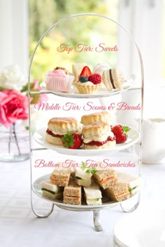 three tiered trays filled with pastries and desserts