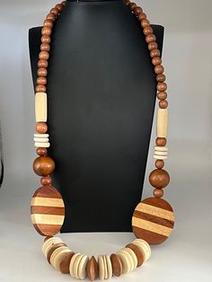 Statement wooden necklace in earth tones. Measures 26 inches long.  Discs are 1.5 inches wide.  A wonderful vintage piece to add to your collection. Vintage Wooden Beads Necklaces, Bling Necklace, Wooden Necklace, Disc Necklace, Vintage Wood, Earth Tones, Wood Beads, Pendant Necklaces, Necklace Etsy