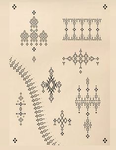 an old cross stitch pattern is shown in black and white, with several smaller crosses on it