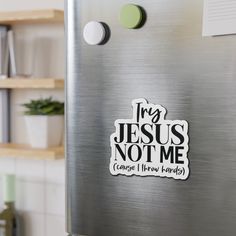 sticker on the side of a refrigerator saying, i'm jesus not me