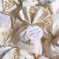 wedding favors wrapped in white paper and tied with twine