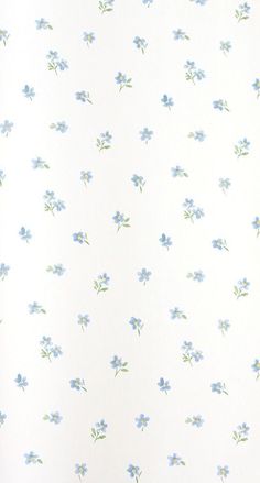 a white wall with blue flowers on it