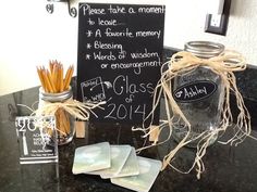 there is a mason jar with some writing on it and three tags attached to it