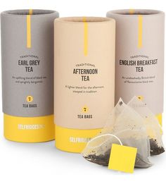 three different types of tea bags with yellow tags on the top and one is empty