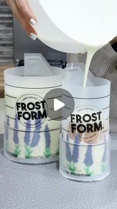 a person pouring frosting into two buckets with flowers on them and the words frost form