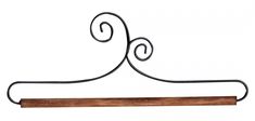 an iron and wood hanger on a white background