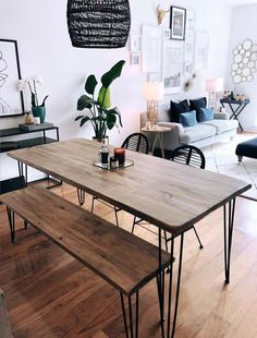 a wooden table sitting on top of a hard wood floor