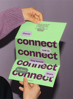 two people holding up signs that say connect