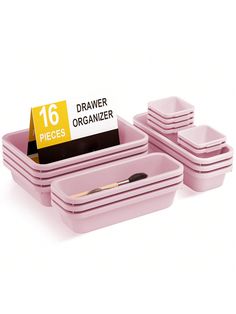 a set of six pink trays with dividers and labels on them for organization