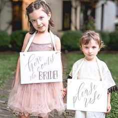 It's that moment... you are about to walk down the aisle. Right before you come out, send your flower girl and ring bearer (or the two cutest kids you can find) down the aisle with this set of banners to let everyone know to rise, because here comes the bride! Make a charming statement with our set of 2 flower girl signs for your wedding ceremony. Featuring the phrases 'Here Comes the Bride' and 'Please Rise,' these signs add a touch of whimsy and tradition to your special day. FEATURES & BENEFI Wedding Signs For Kids To Carry, Mayun Decor, Here Comes The Bride Sign, Ceremony Signage, Rose Garden Wedding, Ring Bearer Signs, Flower Girl Signs, Bride Sign, Ring Bearer Flower Girl