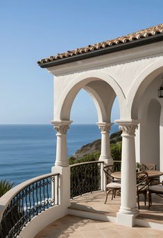 an outdoor dining area overlooking the ocean