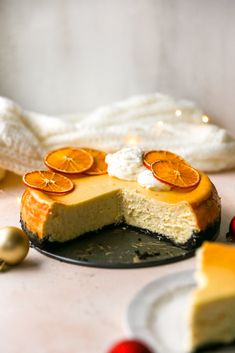 there is a cheesecake with orange slices on it