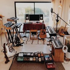 a room filled with musical instruments and sound equipment