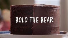 two pieces of chocolate cake on a plate with the words bolo the bear in white lettering