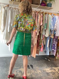 Dosa Green Silk Wrap Skirt. A fun and bright knee-length skirt in a grass green textured silk. Gives a modern-luau vibe! Interior is lined in a gorgeous patchwork stitched pattern, so the skirt could potentially be worn reversible as well! Wrap ties at the waist, allowing for an adjustable fit. Marked one size, but best fits a size M/L. 100% silk, dry clean only. Made in the USA. In excellent, like-new condition. Approx. Measurements: Adjustable waist: 15" through 18" laid flat across Length: 21 Spring Green Relaxed Skirt, Green Relaxed Skirt For Spring, Green Lined Skirt For Spring, Green Knee-length Summer Skirt, Knee-length Green Summer Skirt, Green Full Skirt For Spring, Spring Silk Lined Pencil Skirt, Green Knee-length Party Skirt, Green Knee-length Skirt For Party