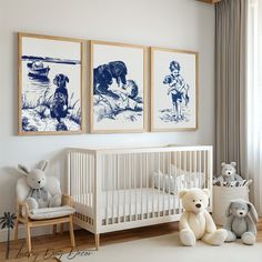 a baby's room with three framed pictures on the wall and two stuffed animals